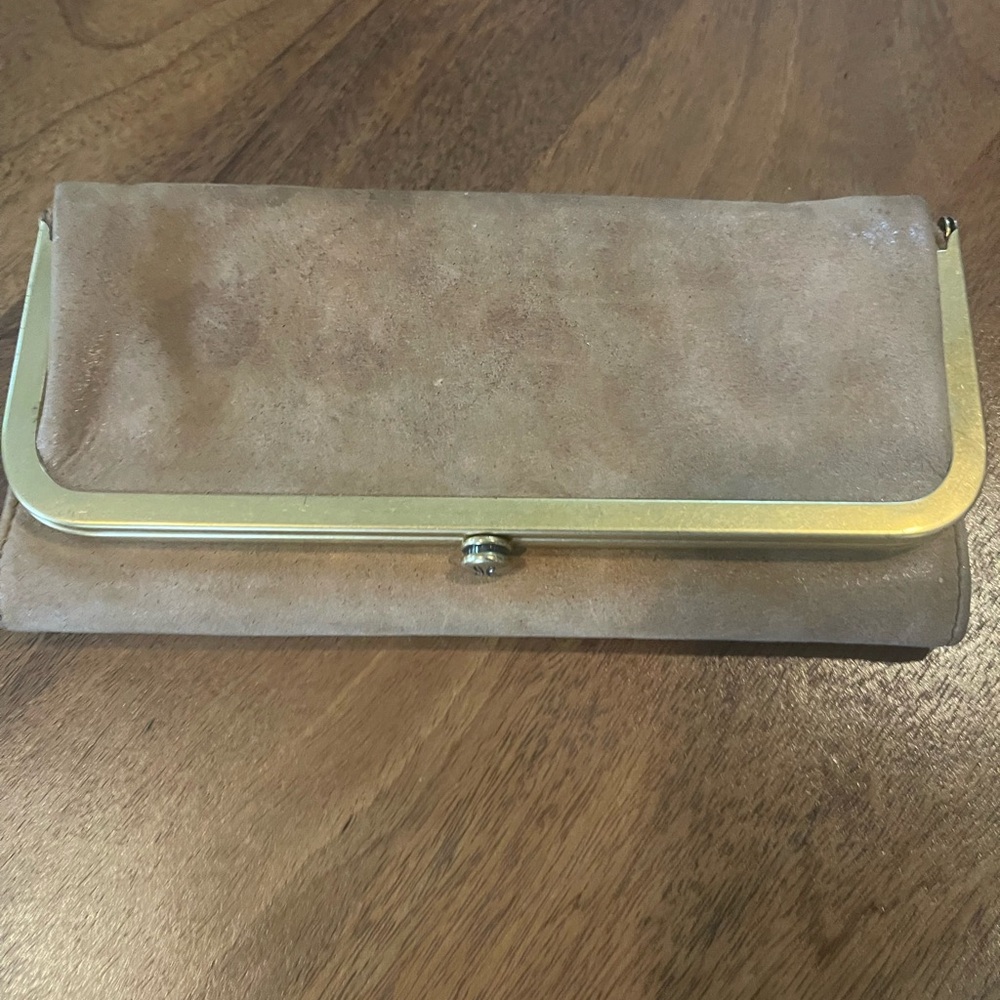 HOBO Tan Clutch with Sleek Design and Gold Clasp